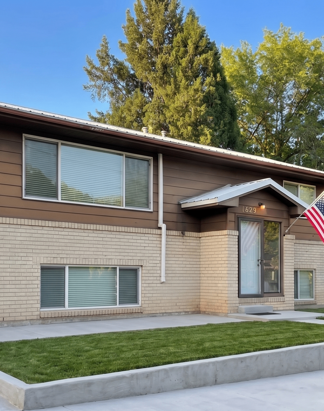 Rising Sun Pocatello brick home entrance with manicured lawn