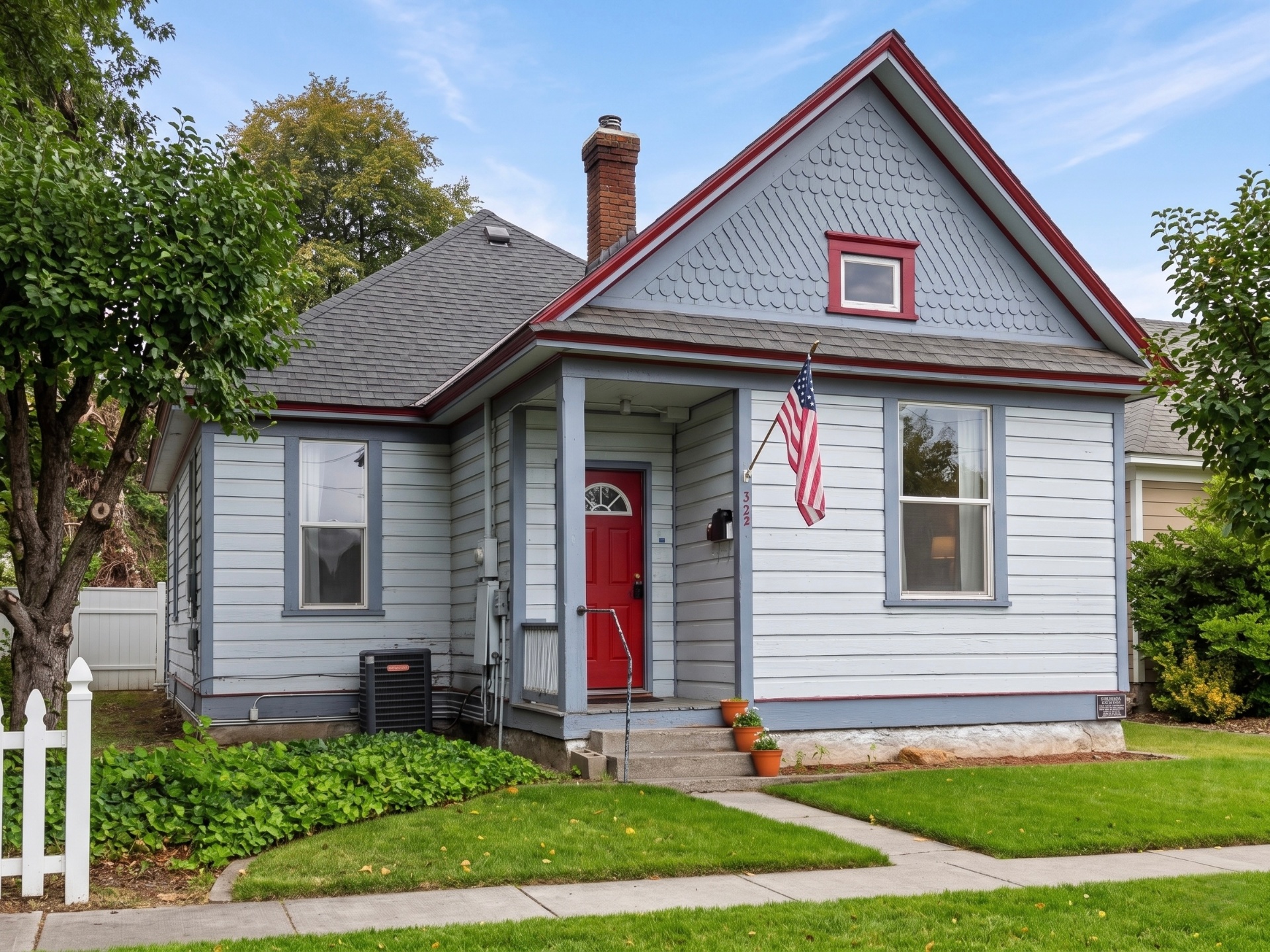 Rising Sun Lewiston gray cottage with red trim