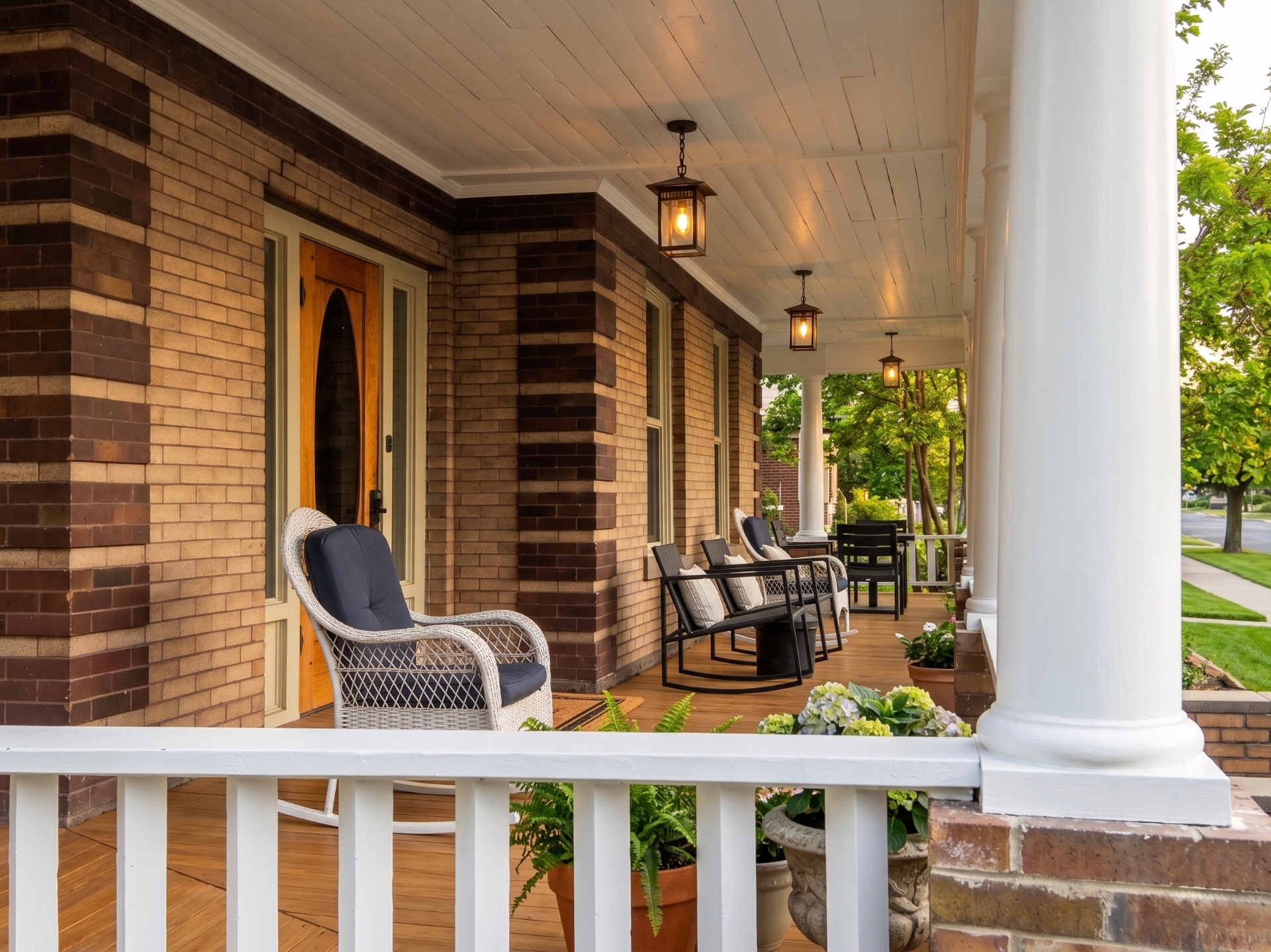 Rising Sun Lewiston brick front porch with lanterns and seating