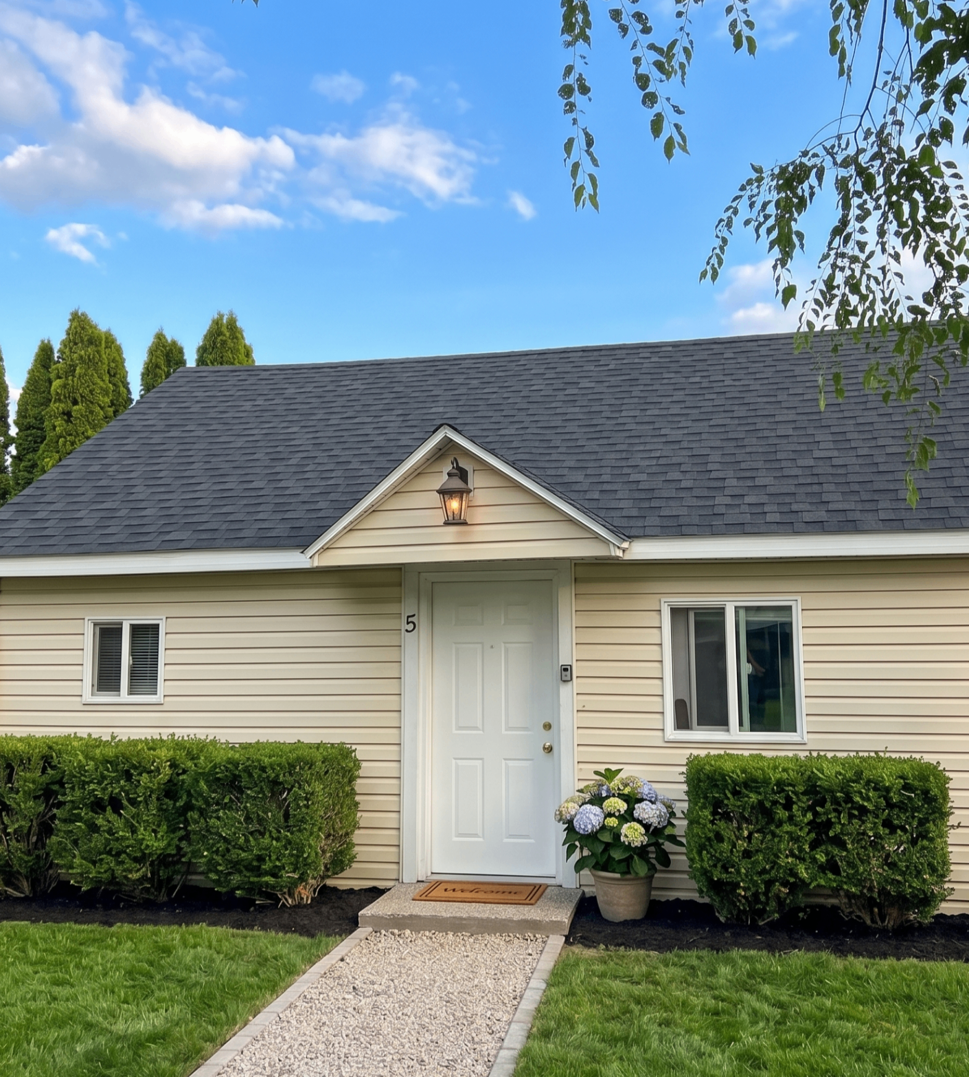 Rising Sun Idaho Falls cottage with front path and trimmed hedges